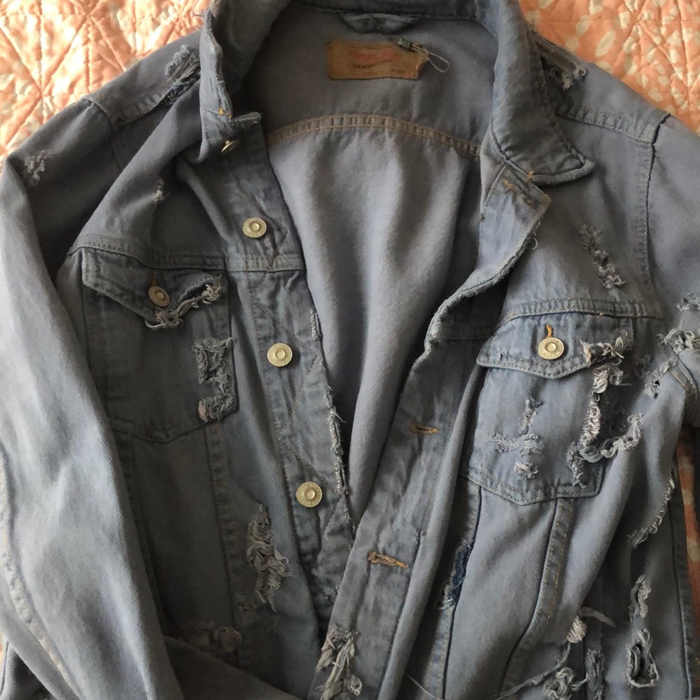 Distressed jean jacket.
